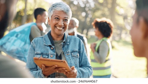 Park, woman and smile planning with tablet for volunteers, community project or nature sustainability. Humanitarian, recycling or senior leader in charity service or NGO for pollution cleanup - Powered by Shutterstock