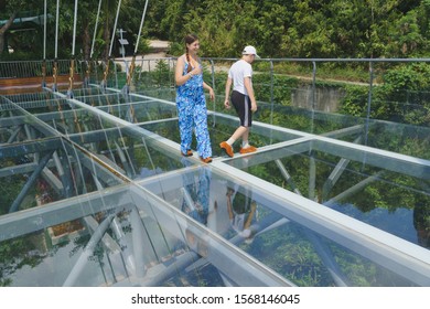 Park Yanoda. Tourists Enjoying The Amazing Glass Floor Bridge High Above The Jungle