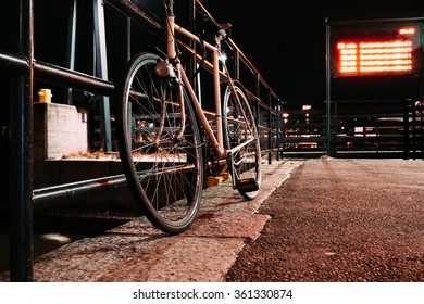 Parked Bicycle At Night Front View.