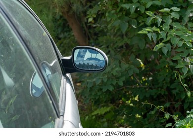 Parked Car Front Door Side View Mirror Seen From Behind, Detail, Closeup, Nobody, No People, Copy Space. Transport, Car Parts, Vehicle Parts Simple Abstract Concept. External Side Mirror, Wing Mirror