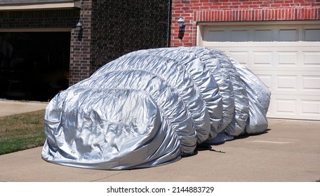  Parked car hail blanket covered protection.                              