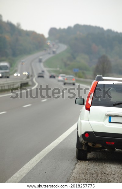 parked car on\
roadside of highway autumn\
season