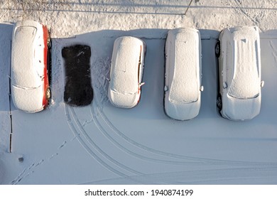 Parked Cars And The Road Are Covered With Smooth Layer Of Snow, Top View, Aerial Photography, Winter Daytime