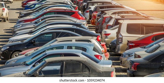 Parked Used Cars Stand On Street During The Day