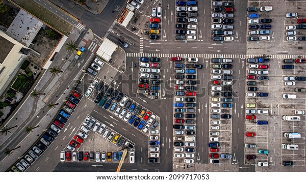 Parking. Aerial view of cars parked in line in\
a parking lot. Colored cars. drone\
view