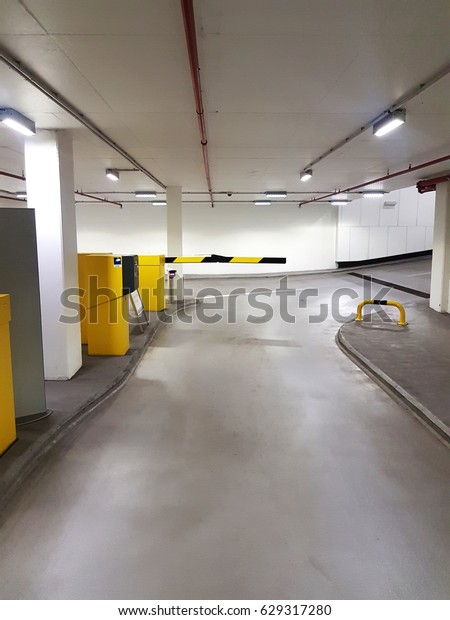 parking barrier gate in garage\
lot for security and pay the entrance or exit with car or\
motorbike
