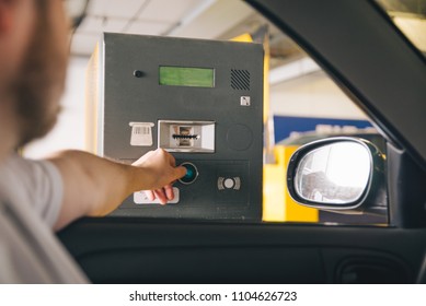 Parking Barrier. Man Taking Ticket To Pass Control On Parking Area