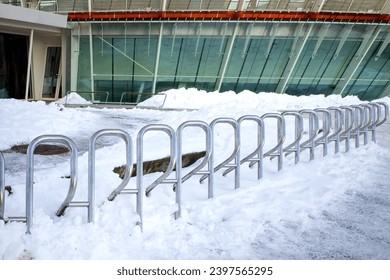 parking for bicycles under snow. empty parking for bike at winter time. - Powered by Shutterstock