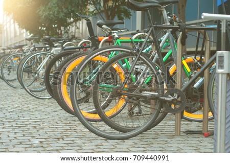 Parking for Bicycles in University with steel bars to lock bikes to.