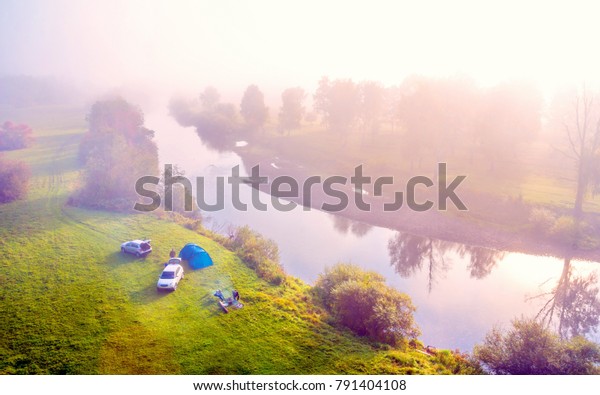 Parking lot for campers on the White River on\
an early sunny morning. View from\
above