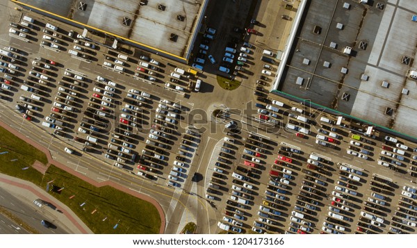 Parking lot with cars aerial\
view.