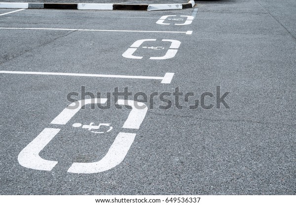 Parking for cars, places for the disabled, sign\
on the asphalt