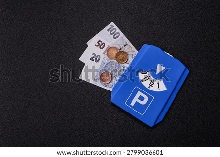 A parking disc, permit, or ticket for measuring time and paying municipal services. A parking disc as a background for your design