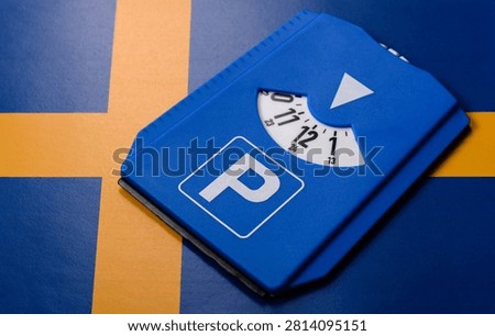 A parking disc, permit, or ticket for measuring time and paying municipal services. A parking disc as a background for your design