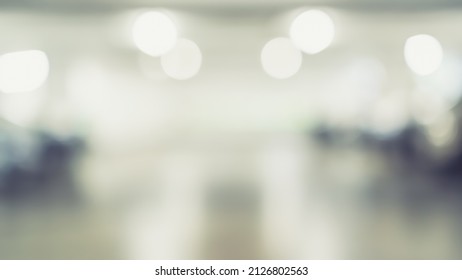 Parking Garage Blur Background With Blurry Building Interior Lot Space And Bright Illumination Light Bokeh For Automotive Vehicle And Car Insurance Safety Concept