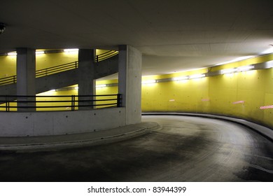 Parking Garage With Bright Neon Lights At Night