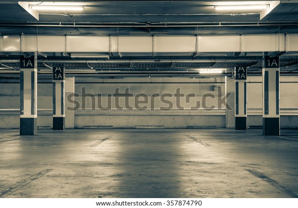 Parking garage interior, industrial\
building,Empty underground Parking car\
background