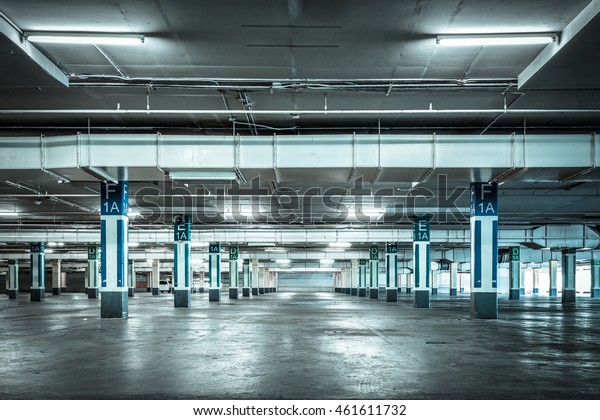 Parking garage interior, industrial\
building,Empty underground parking\
background