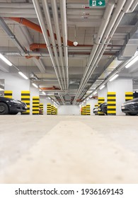 Parking garage. Shot of car park or underground parking with cars.