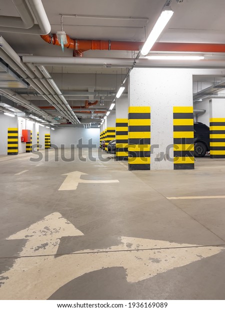 Parking garage. Shot of car park or underground\
parking with cars.