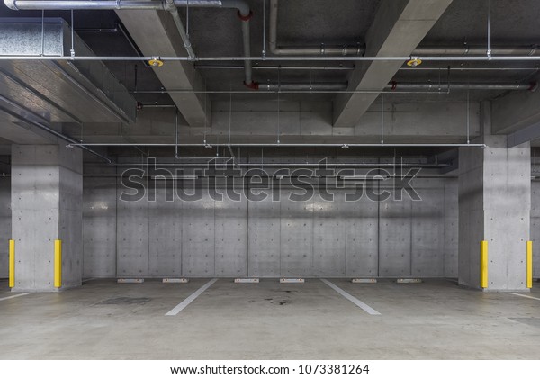 Parking garage underground\
interior with neon lights Empty Parking lot Car park at underground\
building