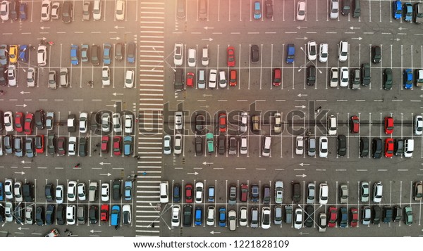 Parking lot with hundreds of cars. Crowded car\
parking. Aerial.