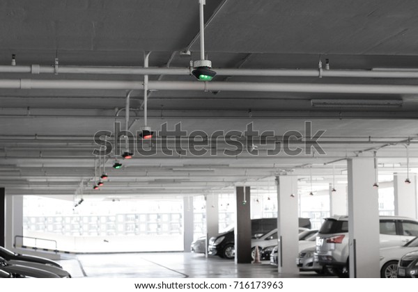 Parking indicator light on\
ceiling is an intelligent car park system with wireless sensor\
networks.