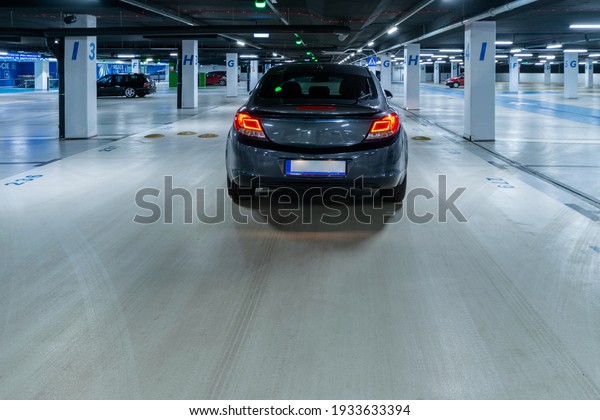 Parking\
lot. Car lot parking space in underground city garage. Empty road\
asphalt background. Ground floor for car\
parking