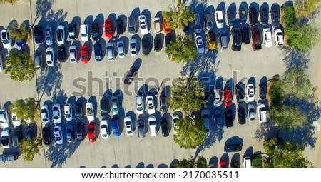 Parking lots full of vehicles. Birds eye view.