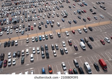 Parking Lot With Many Parked Cars At Business Center Or Mall, Aerial View. City Transportation Concept