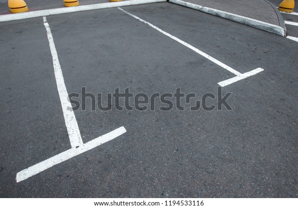 Parking, marking on\
the asphalt parking spaces. The concept of a lack of parking in\
megacities, paid\
parking