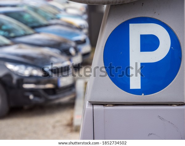 Parking meter with\
parking lot in a city
