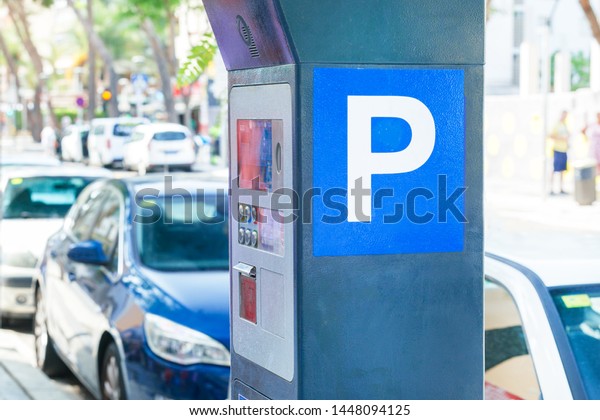 Parking Meter on the street of city. Machine\
parking on a city\
street.