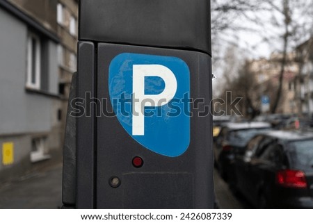 Parking meter, Parkometr or Parkomat in paid parking zone of city centre downtown district. Car park pay and display ticket machine.