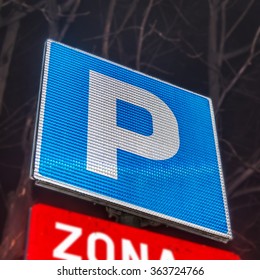 Parking lot with number of authorized parking sign