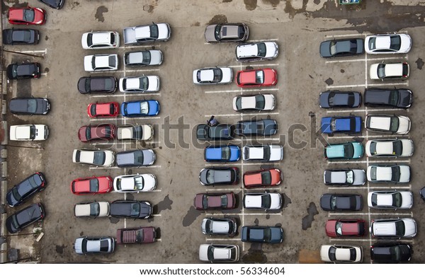 Parking with\
parked cars. Aerial view from a\
height.