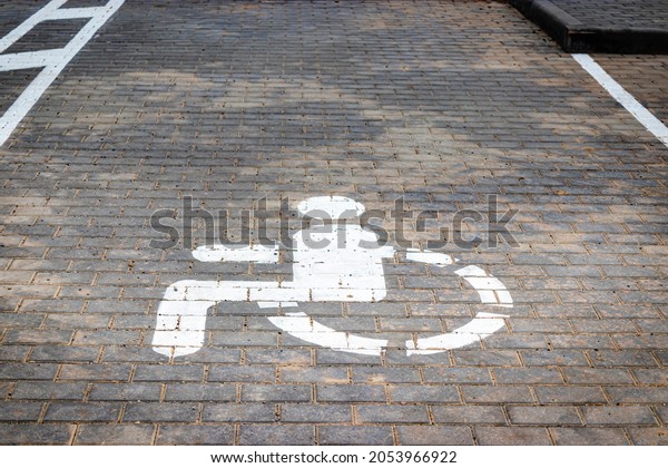 Parking for people with\
disabilities. A sign indicating a parking place for people with\
disabilities