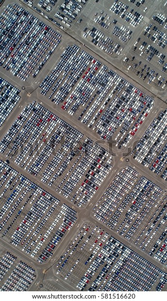 Parking port. Automobile\
factory. New car factory awaiting transport from the port.Aerial\
view.Top view.