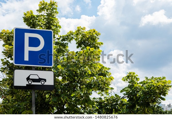 Parking roadsign outdoors,\
car storage