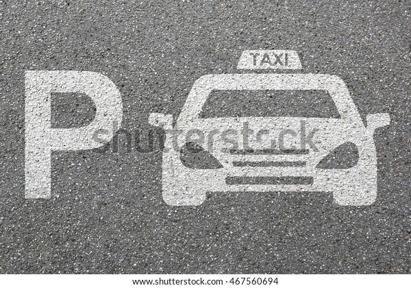 Parking lot sign car park taxi\
cab sign vehicle street road traffic town city mobility\
transport