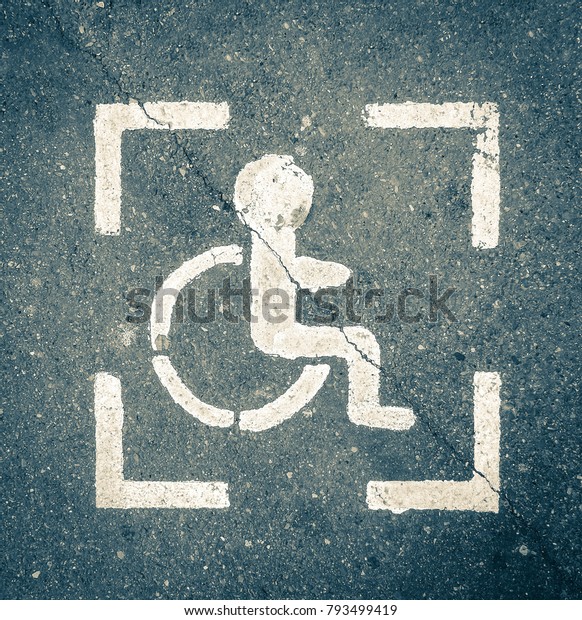 Parking sign for\
disabled people on\
asphalt