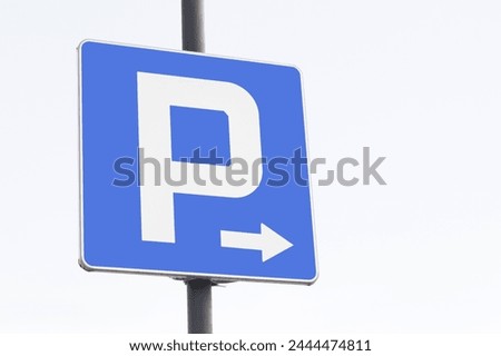 Parking sign isolated. Metal pipe pole signpost road sign. Empty copy space traffic sign. White arrow car park dirrection.