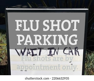 Parking Sign Posted At A Clinic For Free Flu Shots