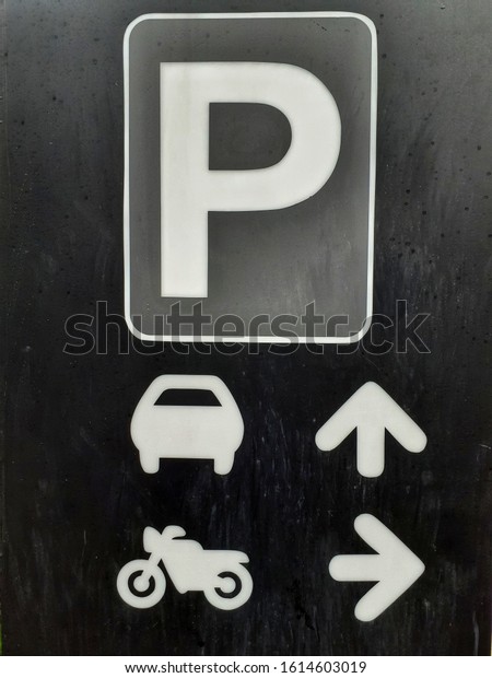 parking lot signs for\
cars and motorbikes