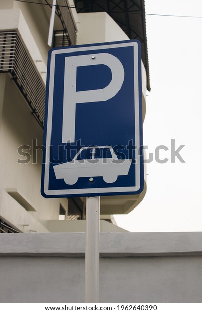 Parking
sign.Vehicles take up too much space in the
city.