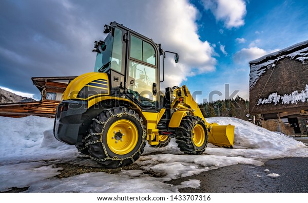 Parking Snow Plowing Truck\
In Winter