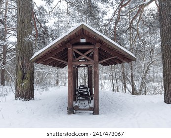 Parking space for bicycles under snow n the winter forest. Bike trails in the forest,  bicycle rack outdoors - Powered by Shutterstock