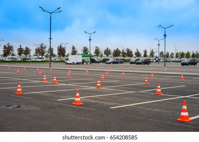 Parking space. Open parking for cars. Signal road cones. - Powered by Shutterstock