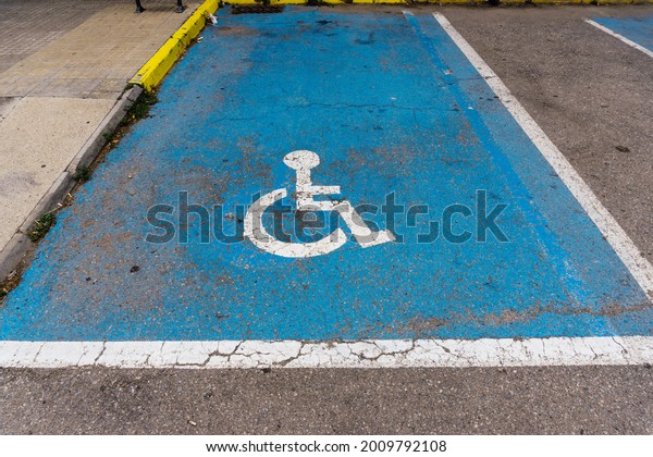 Parking space reserved for people with\
disabilities in\
wheelchairs