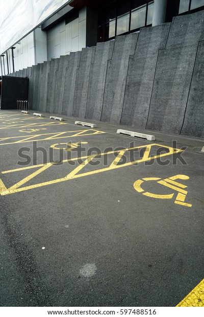 Parking spaces reserved for the disabled in\
outdoor lot for the\
public